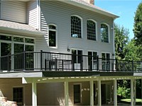 <b>Trex Composite Deck with Black Aluminum railing and gray fascia wrap white post and beam wrap</b>